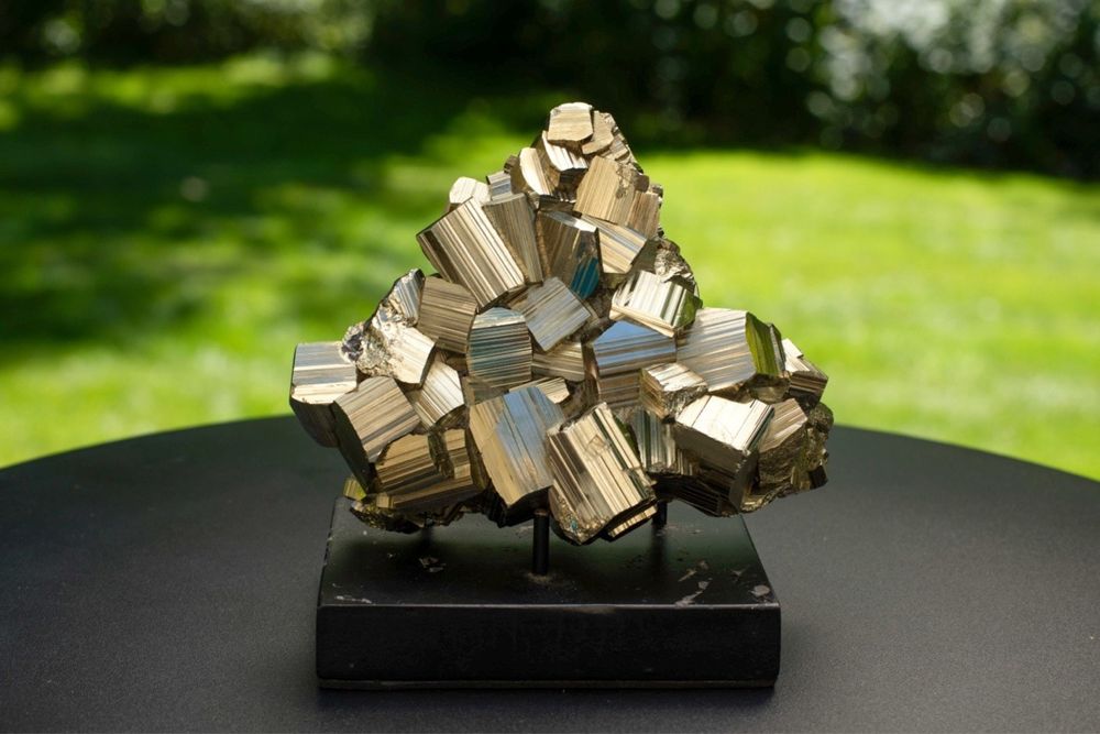 Golden pyrite cube cluster on a black stand, 2.53 pounds